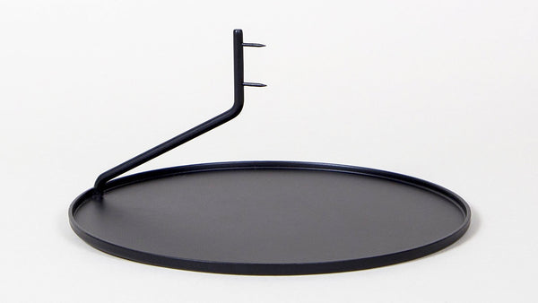 Buka Candlestick by Diiis for Souda. Simple, elegant, and mysterious, the Buka Candlestick uses two pins to suspend a candle above a metal dish - giving it the appearance that it's levitating.