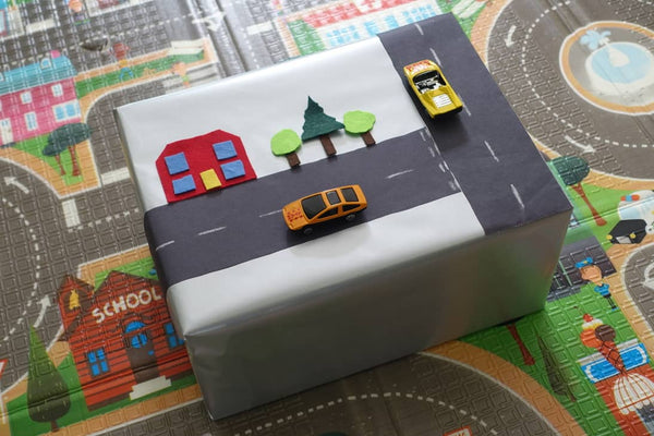 Baby gift wrapped with a road