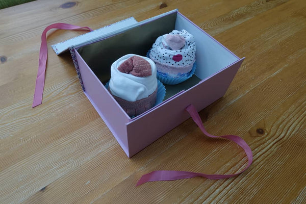 Baby clothes wrapped as cupcakes