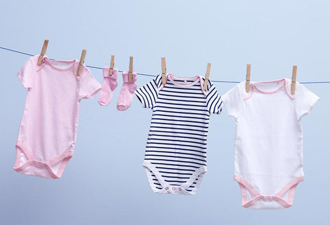 organic baby clothes on wash line