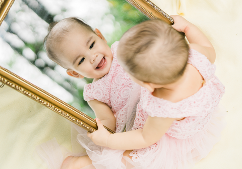 Use mirror to ease into tummy time if your baby doesn't show interest