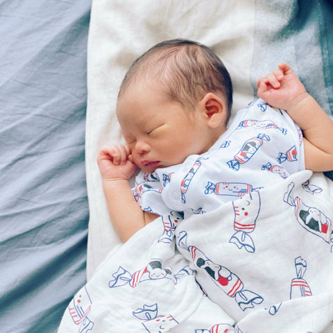 Swaddles and onsies are great welcome home gifts for babies
