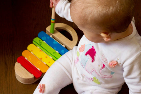 Prepare to be impressed with how well your baby is able to reach for toys at 7 months old.