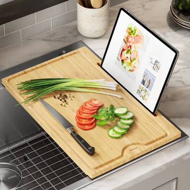 https://cdn.shopify.com/s/files/1/2568/3480/products/KRAUS-Solid-Bamboo-Cutting-Board-with-Mobile-Device-Holder-for-most-Standard-Kitchen-Sinks-KRAUS-DirectSinks_384x384.jpg?v=1654325459
