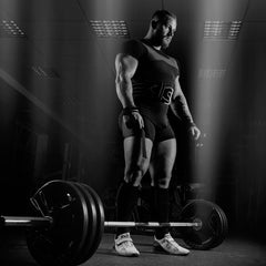 Image of a woman in athletic apparel working out her back on a fitness machine.