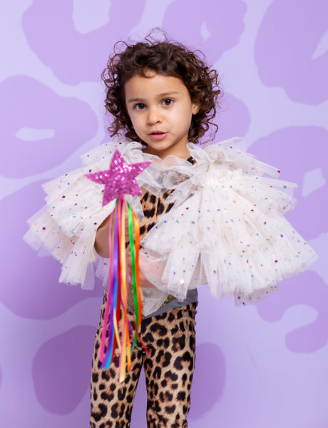 girl wearing glittery tutu cape with leopard print catsuit and holding glittery wand
