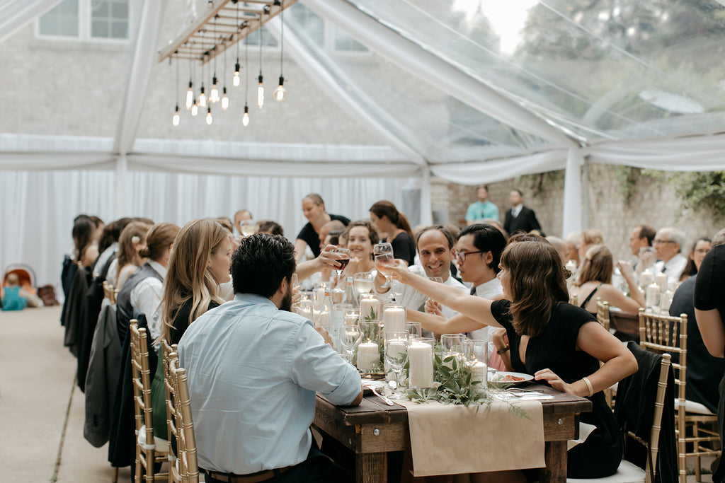 outdoor anniversary dinner under clear tent