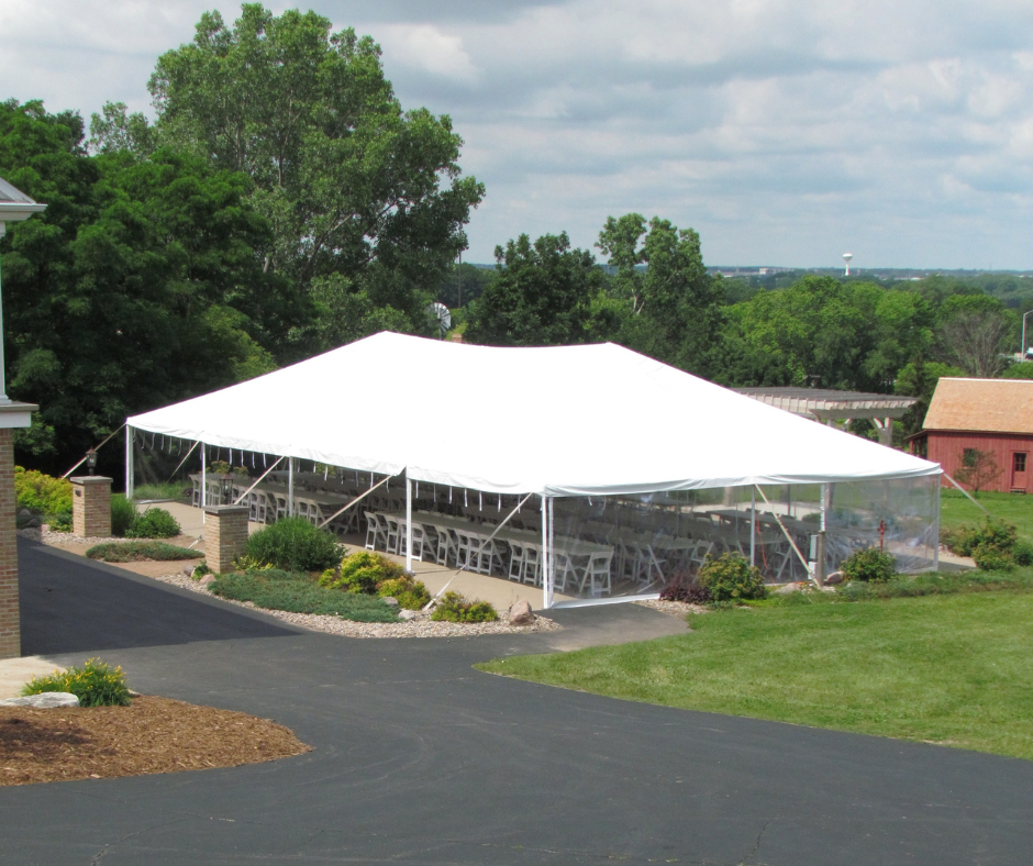 banquet style seating arrangement under tent