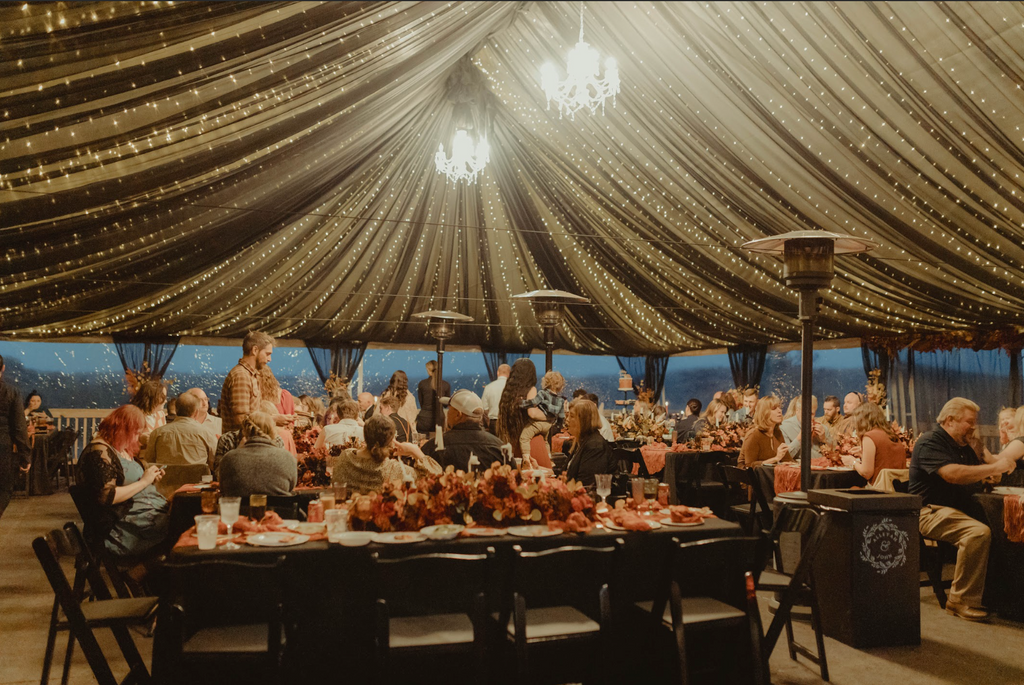 wedding tent with sheer draping and lights