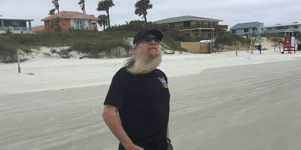 Pete headshot standing on the beach