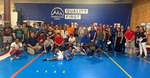 staff shot in front of quality first banner