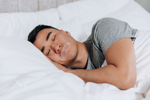 Man sleeping with mouth tape