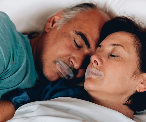 A couple uses mouth tape for snoring prevention