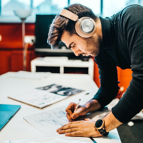 A man listens to music while working.