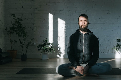 A man practices meditation.