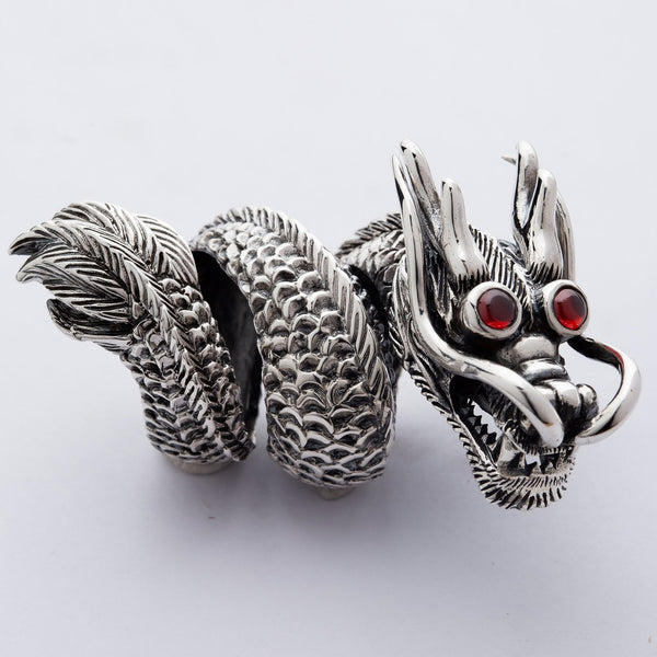 huge & heavy sterling silver Chinese dragon ring with red eyes.