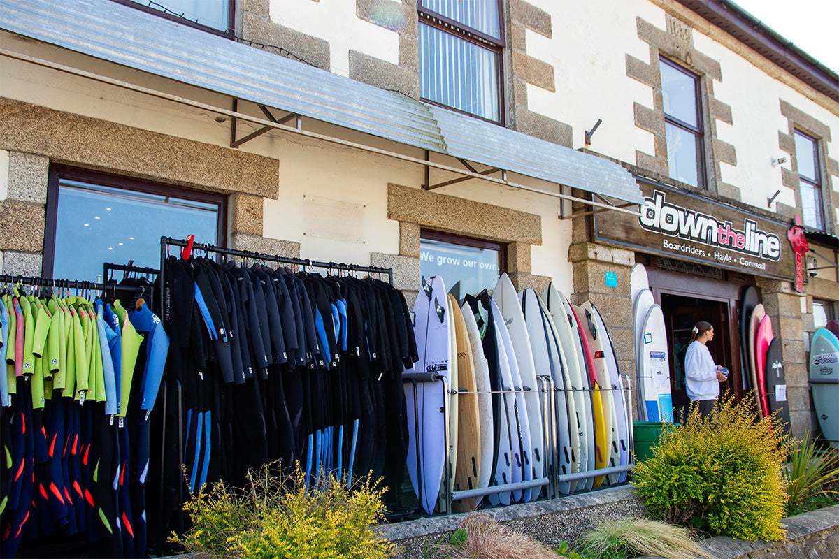 looking along the front of down the line surf shop in hayle