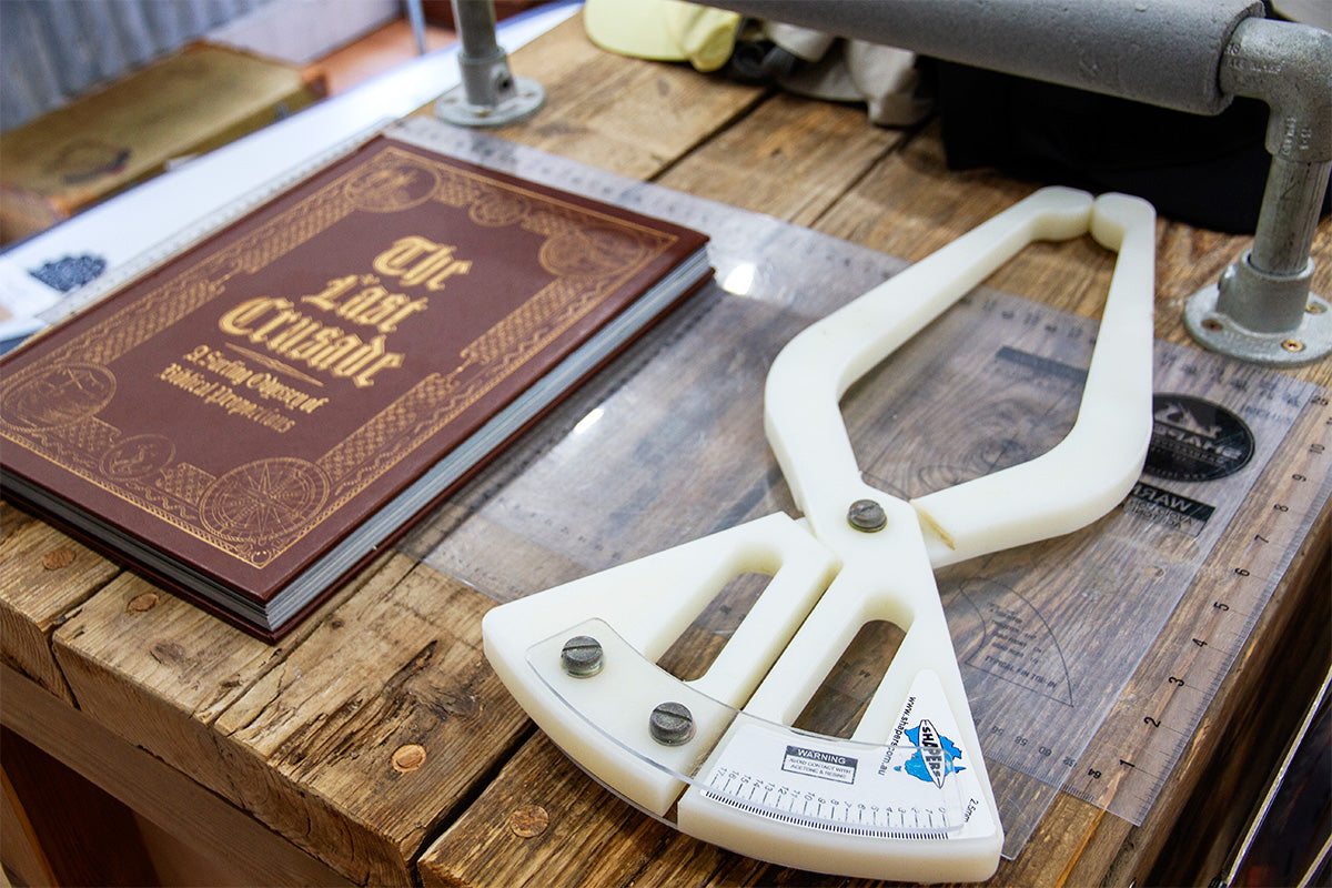 surfboard shaping calipers on the display table in the JS garage at Down The Line