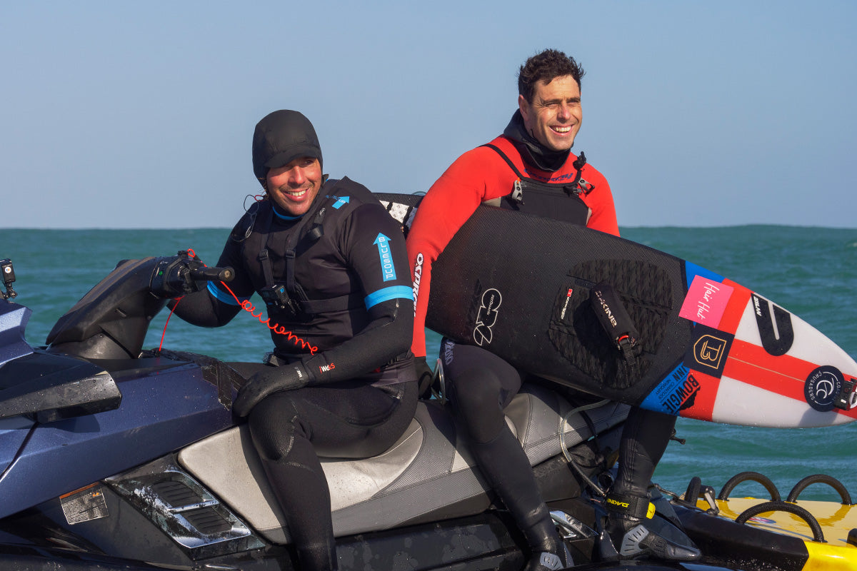 big wave surfers adam griffiths and tom butler on a jet ski during the filming of a BBC documentary about surfing the stones