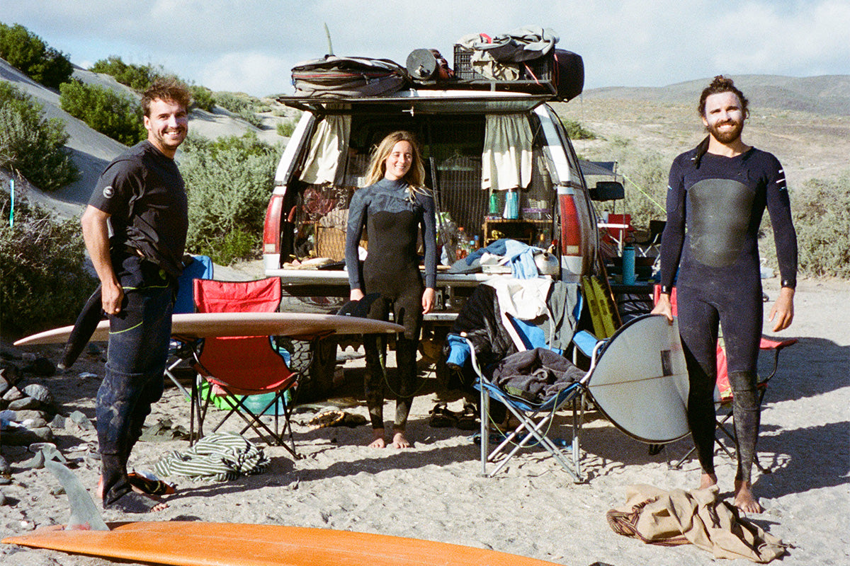 tom baldwin, beth leighfield and paul bertrand camping out of the backof a truck in baja mexico