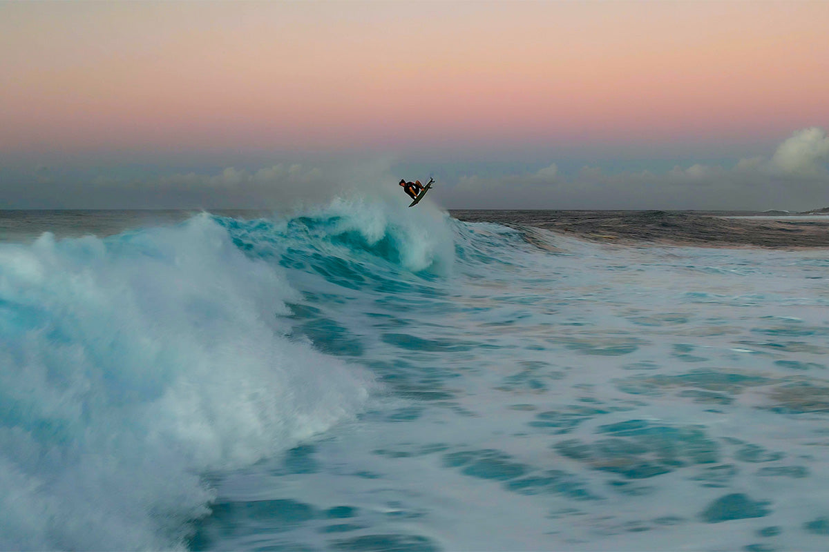 matt meola doing an air at sunset