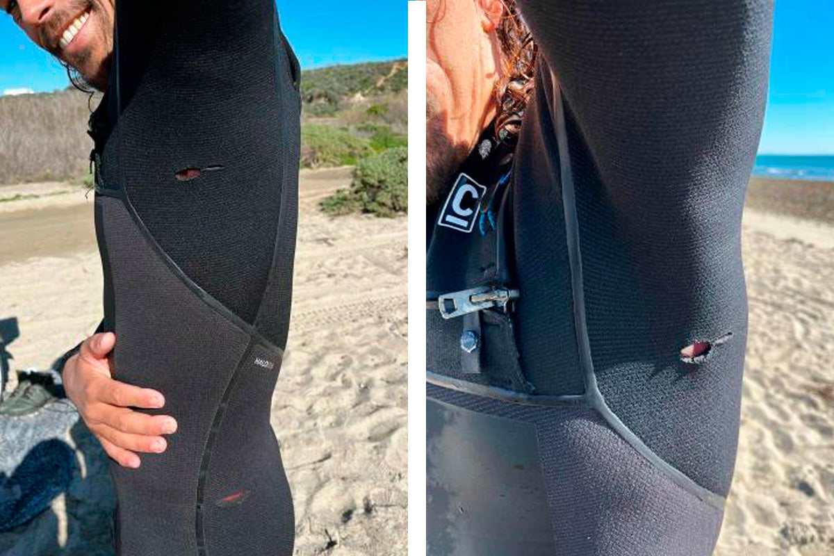 surfer edouard delpero showing where his surfboard fins have cut his wetsuit