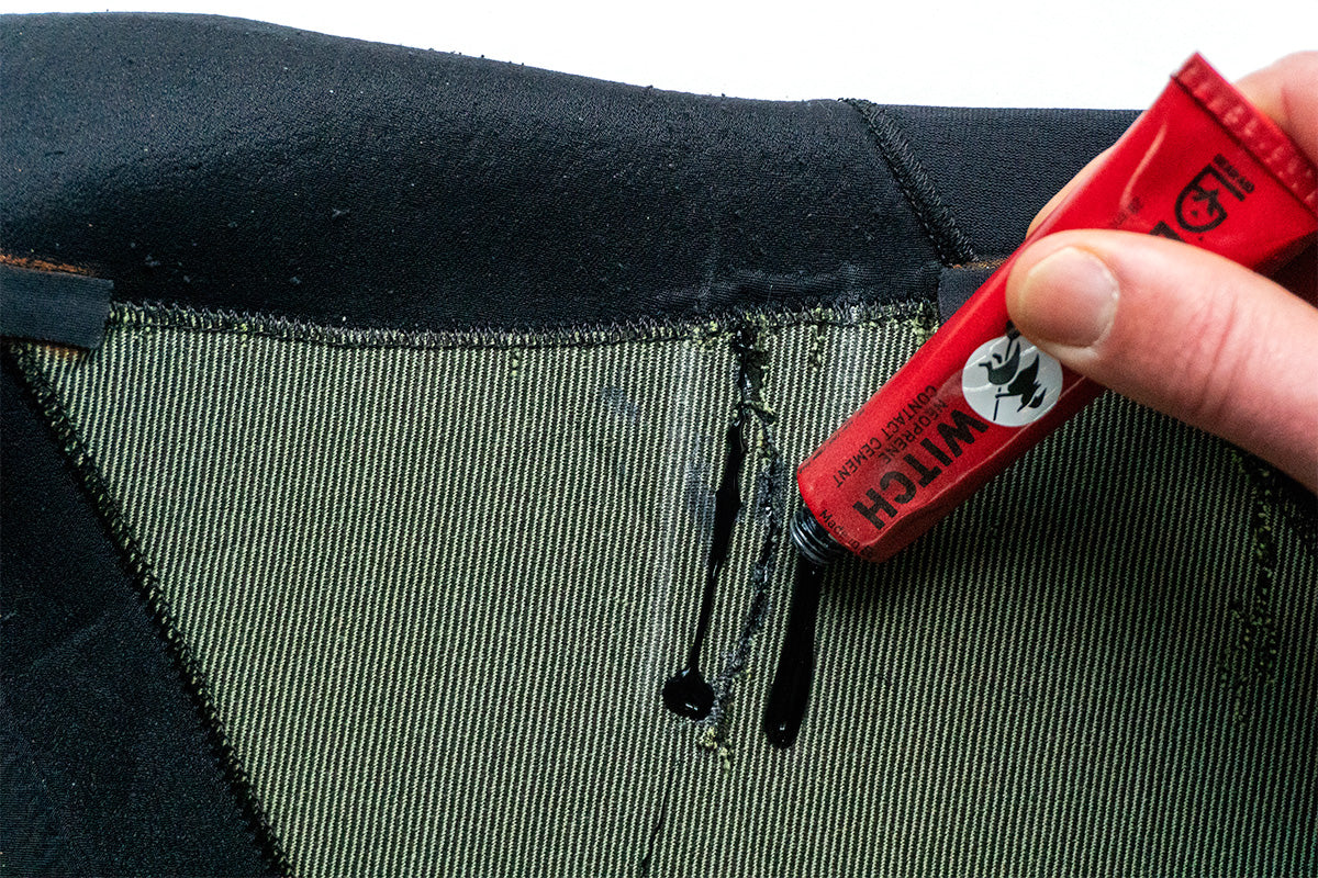 using black witch neoprene adhesive to repair a wetsuit