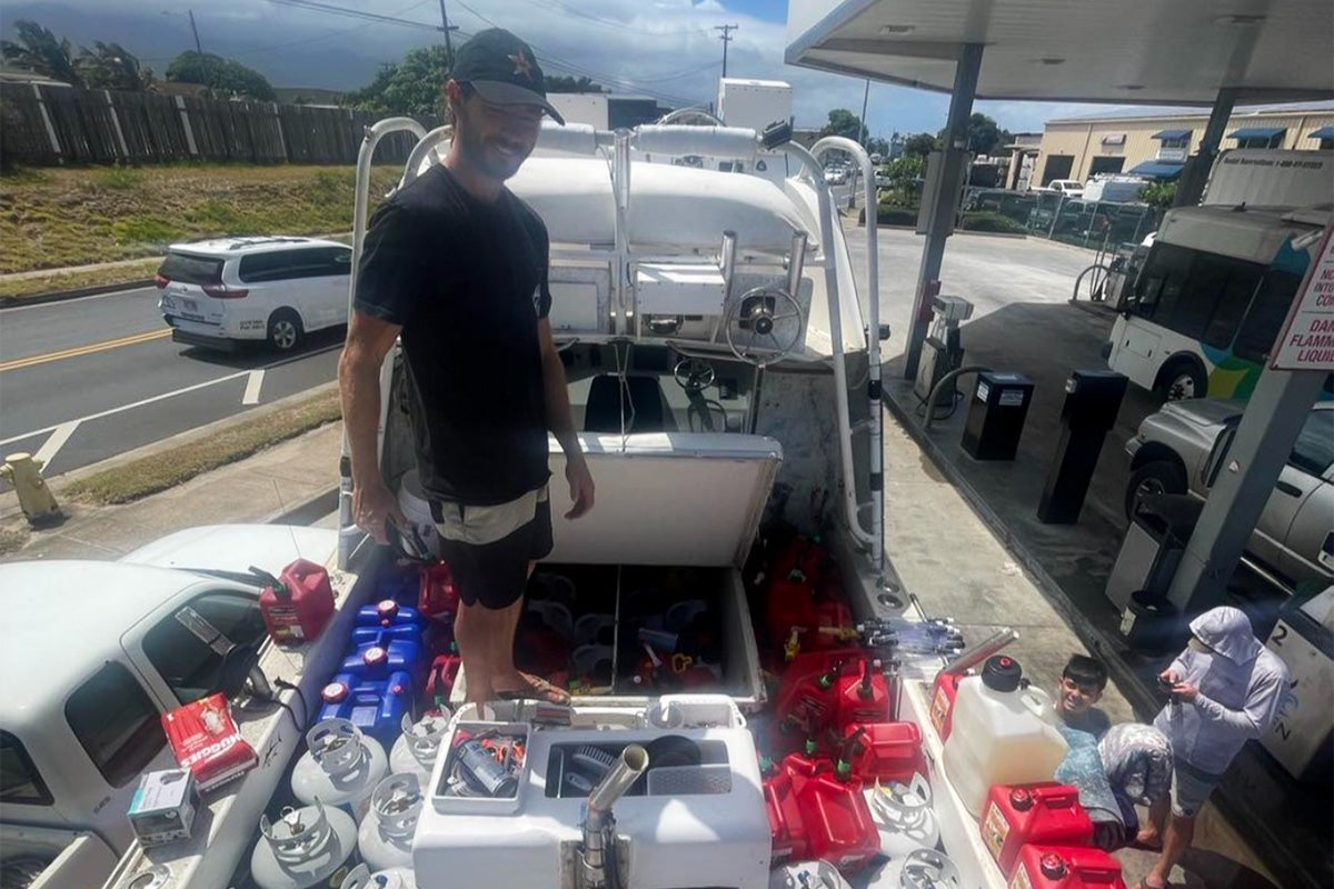 matt meola surrounded by fuel cans during relief efforts after the maui wildfires