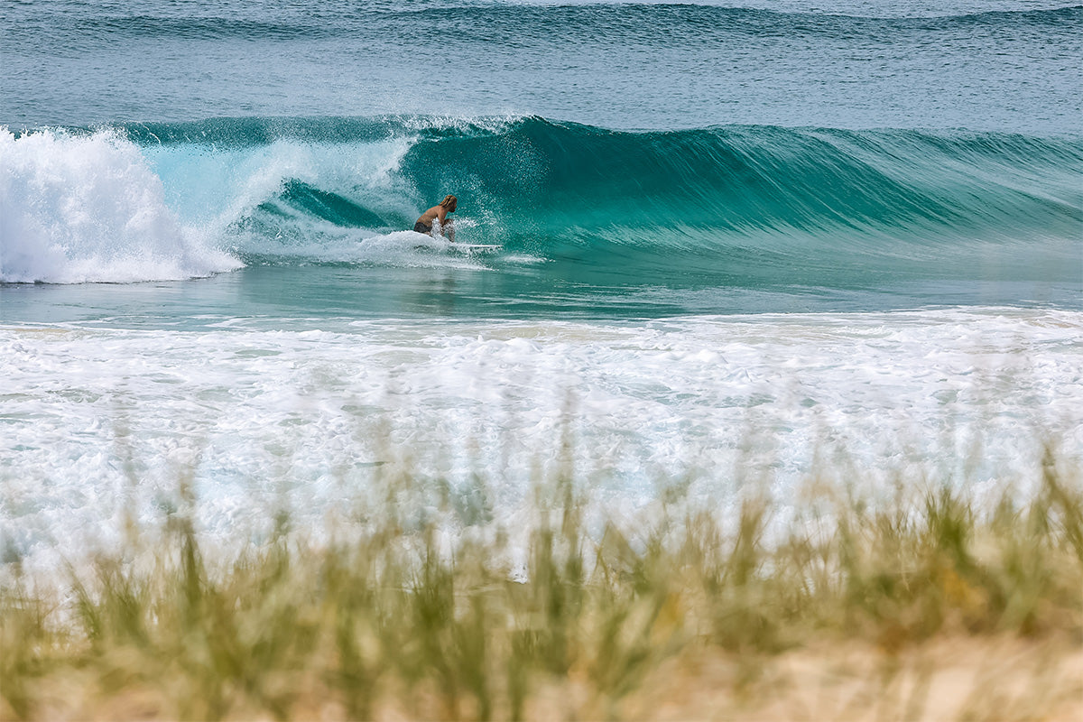 wade carmichael tucking in to a barrel on a clear day at south stradbroke island, by swilly