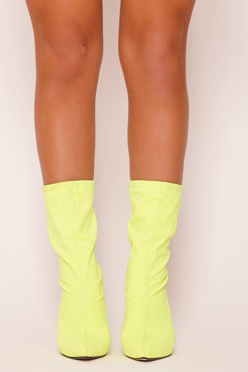 neon yellow knee high boots
