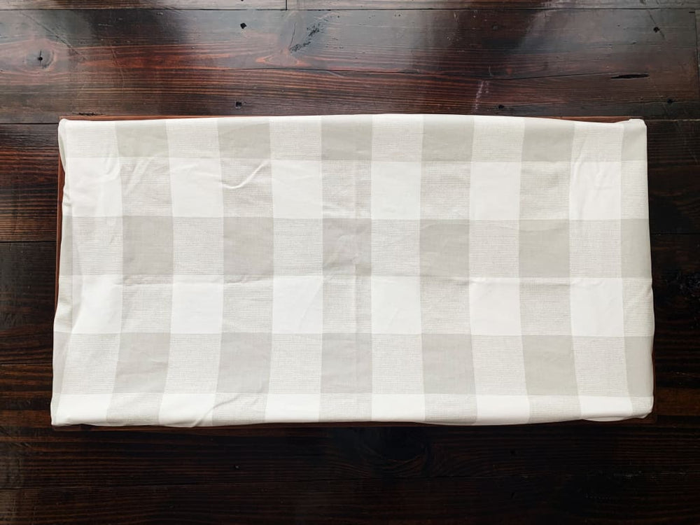 https://cdn.shopify.com/s/files/1/2574/7052/products/grey-buffalo-check-changing-pad-cover-high-cotton-textile-white-handkerchief-napkin-plaid-linens-beige-402.jpg?v=1596065019&width=1000