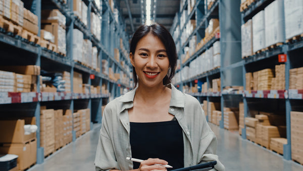 Happy woman in warehouse