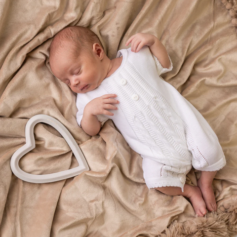 baby wearing a white romper