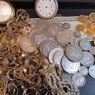 a display of jewelry and coins