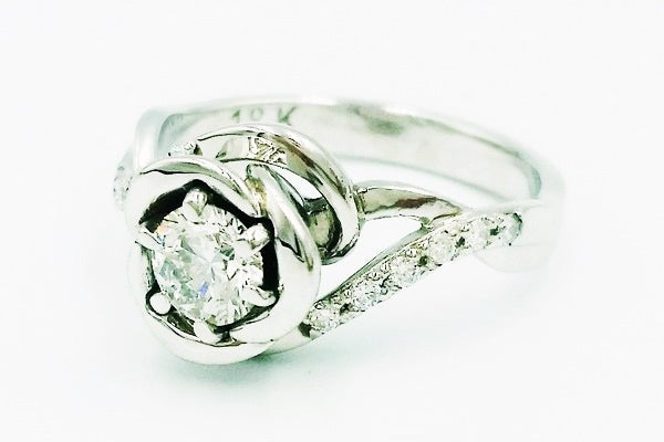 Flower engagement ring project set with diamonds hand-crafted in our jewelry workshop