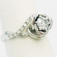 custom engagement ring hand-crafted with diamonds