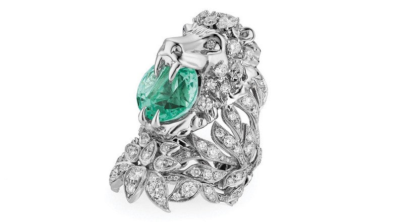 Blue neon paraiba tourmaline stone set on a massive lion ring from Gucci