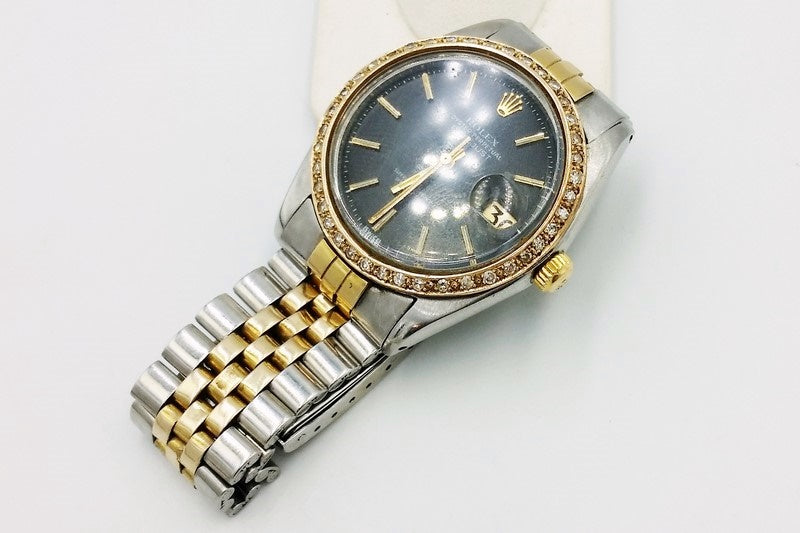 rolex oyster perpetual datejust customized with a 18k gold bracelet iced out with real diamonds