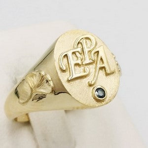 Gold signet ring with initials engraved