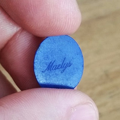 name intaglio carving for jewelry in lapis lazuli