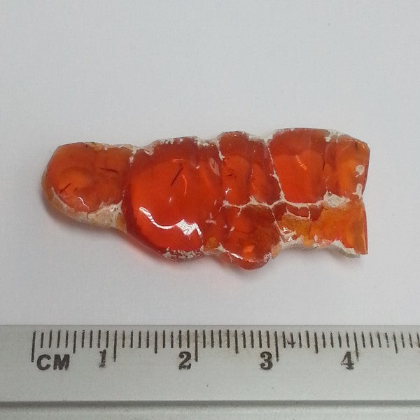 orange mexican opal that weights 22 carats