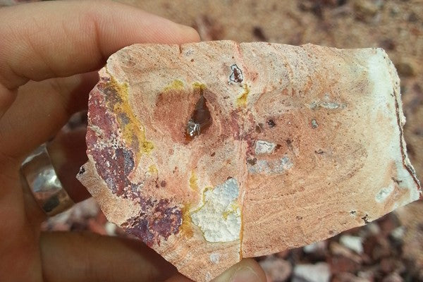 view of an opal rough stone looking for mexican fire opal lights