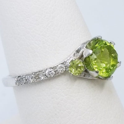 white gold ring with green peridot stone