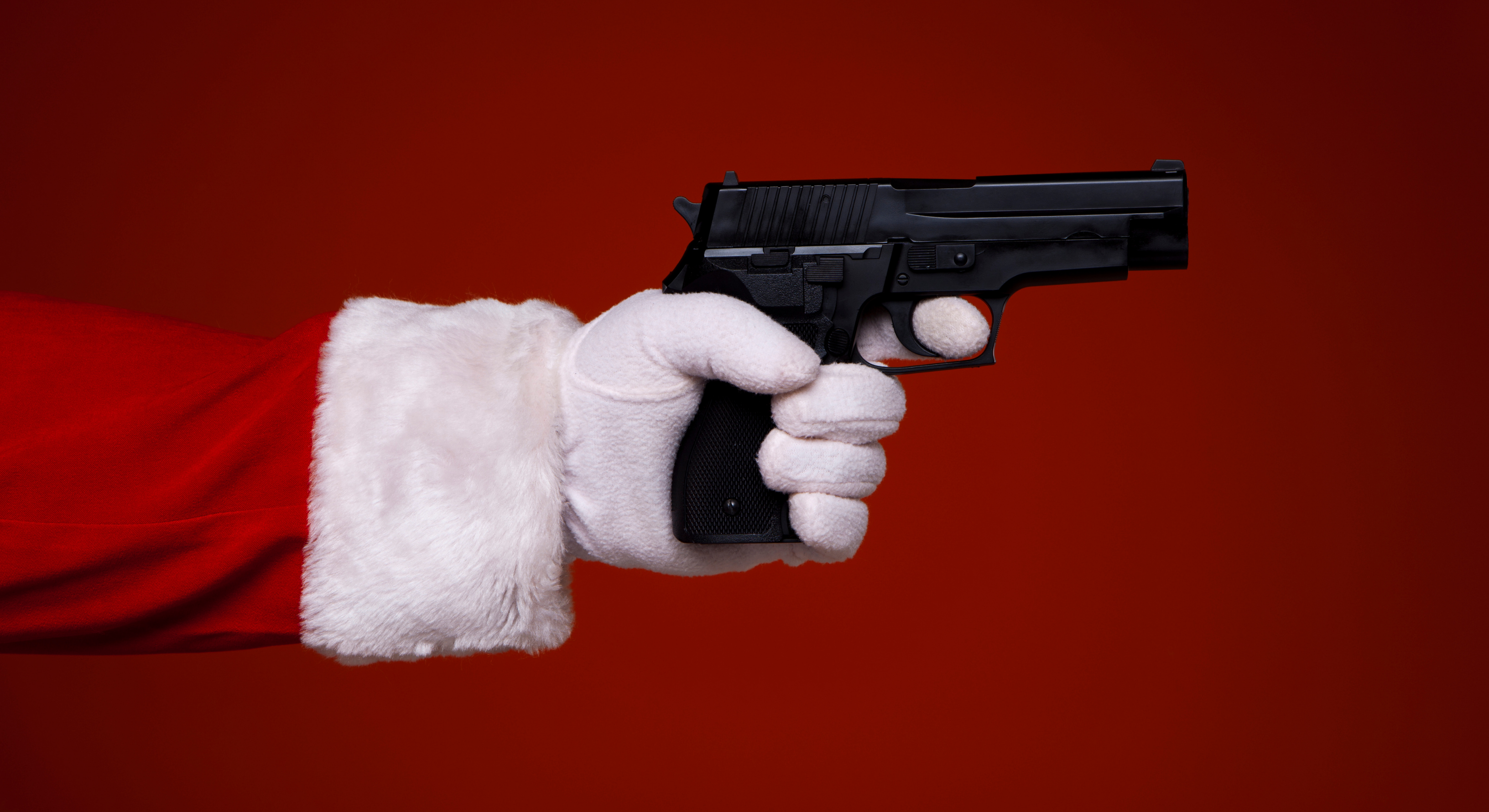 Christmas weapon. Santa with Gun. Santa Claus with a Gun. Santa Klaus Gun. Shooting Santa.