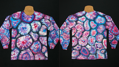 Front & back side of a size medium long sleeve tie dye shirt featuring an array of blues & pinks in a double-sided geode design