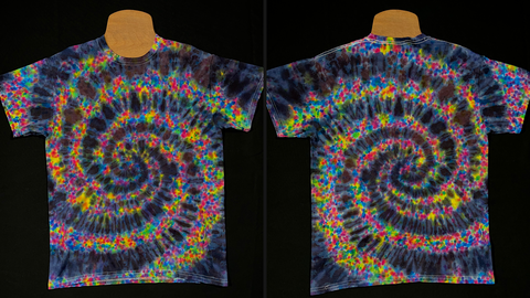 A side-by-side collage featuring both the front and back side of a size medium splatral tie dye shirt; a design featuring an intense, black spiral with vibrant, rainbow speckled, splatter pattern detailing in-between