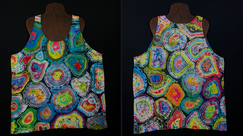 Front & back side of a one of a kind pastel rainbow colored geode pattern tie dye tank top; laid flat on a solid black background