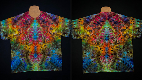 Front & back side of a size xxl rainbow psychedelic mindscape abstract symmetrical ice tie dyed shirt design; laid flat on a solid black background