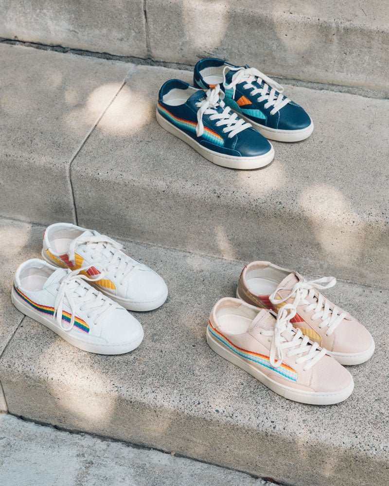 white sneakers with rainbow