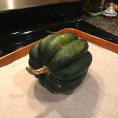 Place the uncooked squash on a pan and put in the oven